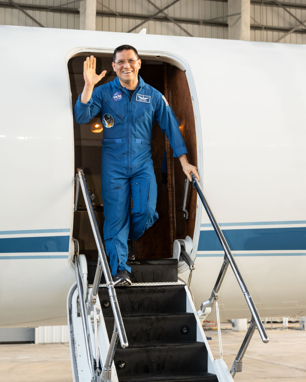 Frank Rubio stepping off a NASA plane at Ellington field in Houston, Texas.