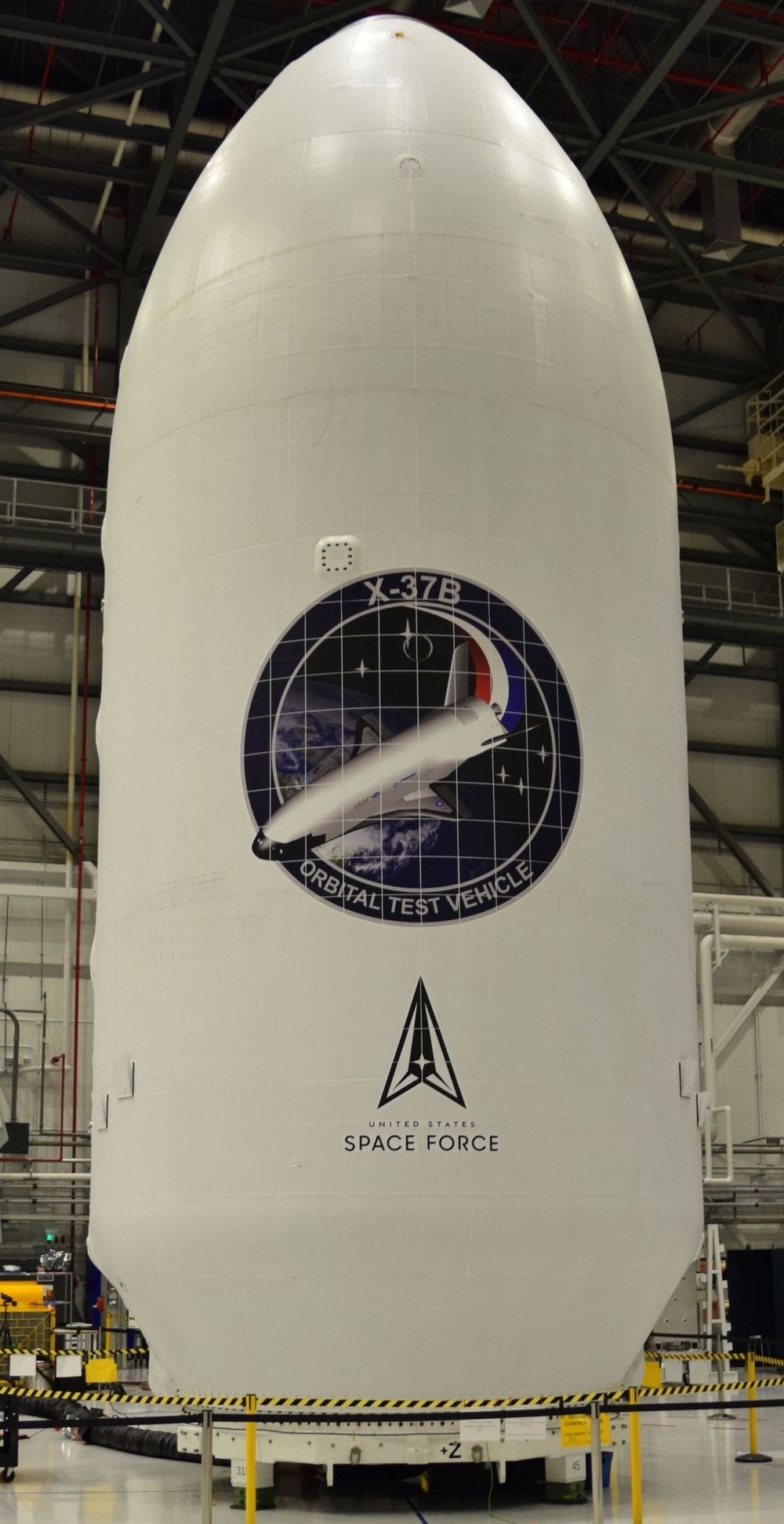 Boeing's X-37B encapsulated within Falcon Heavy's fairings in the payload processing facility. ©Boeing