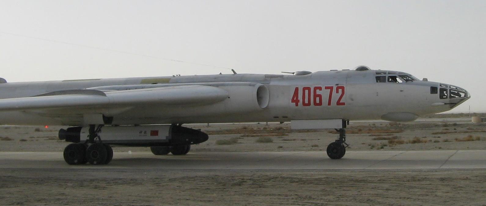 The reusable space vehicle's believed technology demonstrator underneath the H-6 bomber.