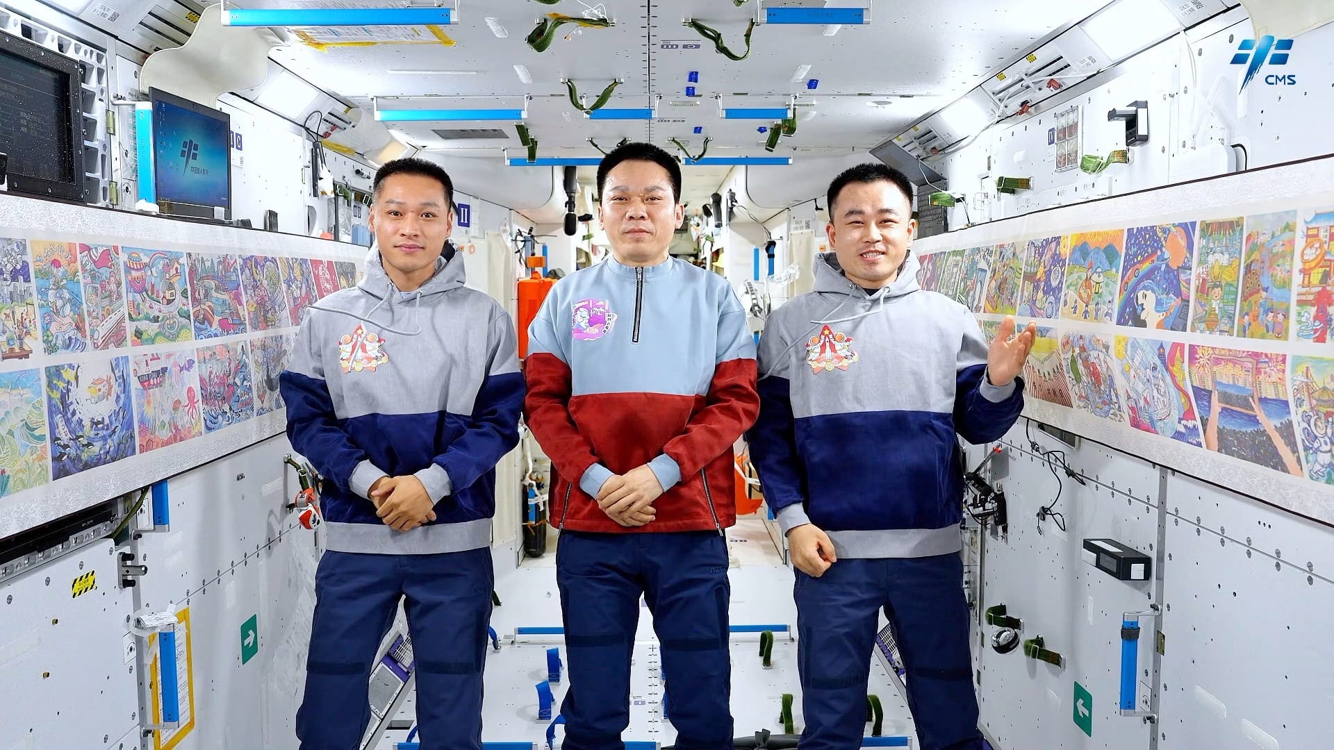 Jiang Xinlin (left), Tang Hongbo (center), and Tang Shengjie (right) during an art exhibition aboard the Tiangong Space Station. ©China Manned Space Agency