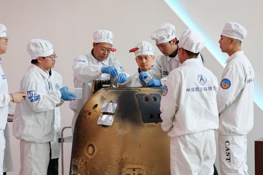 The Chang'e 6 re-entry capsule being opened during a ceremony at the China Academy of Space Technology in Beijing. ©Xinhua