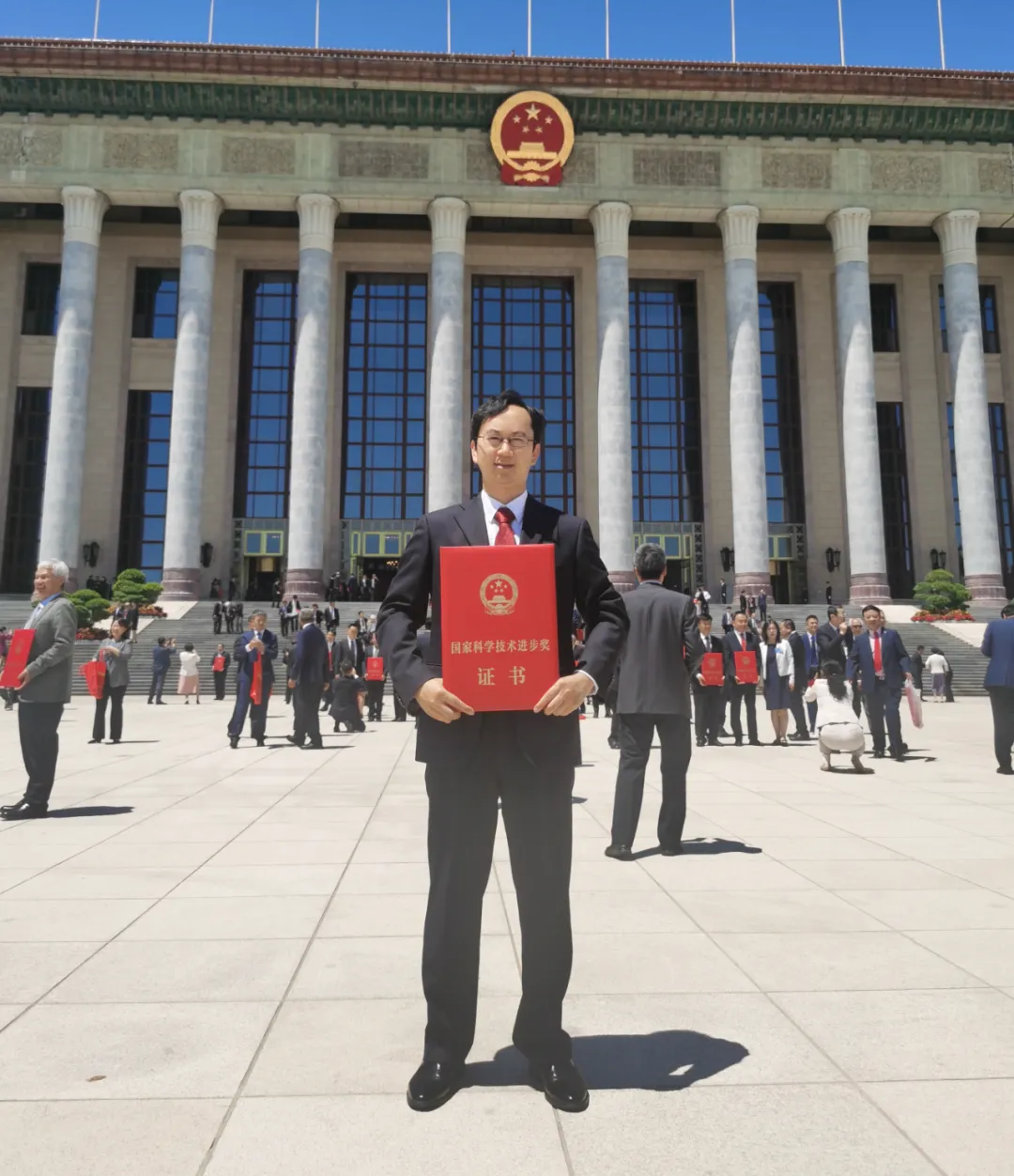 LandSpace's Liu Lei (刘磊) outside of the Great Hall of the People in Beijing holding the award certificate that the company received. ©LandSpace