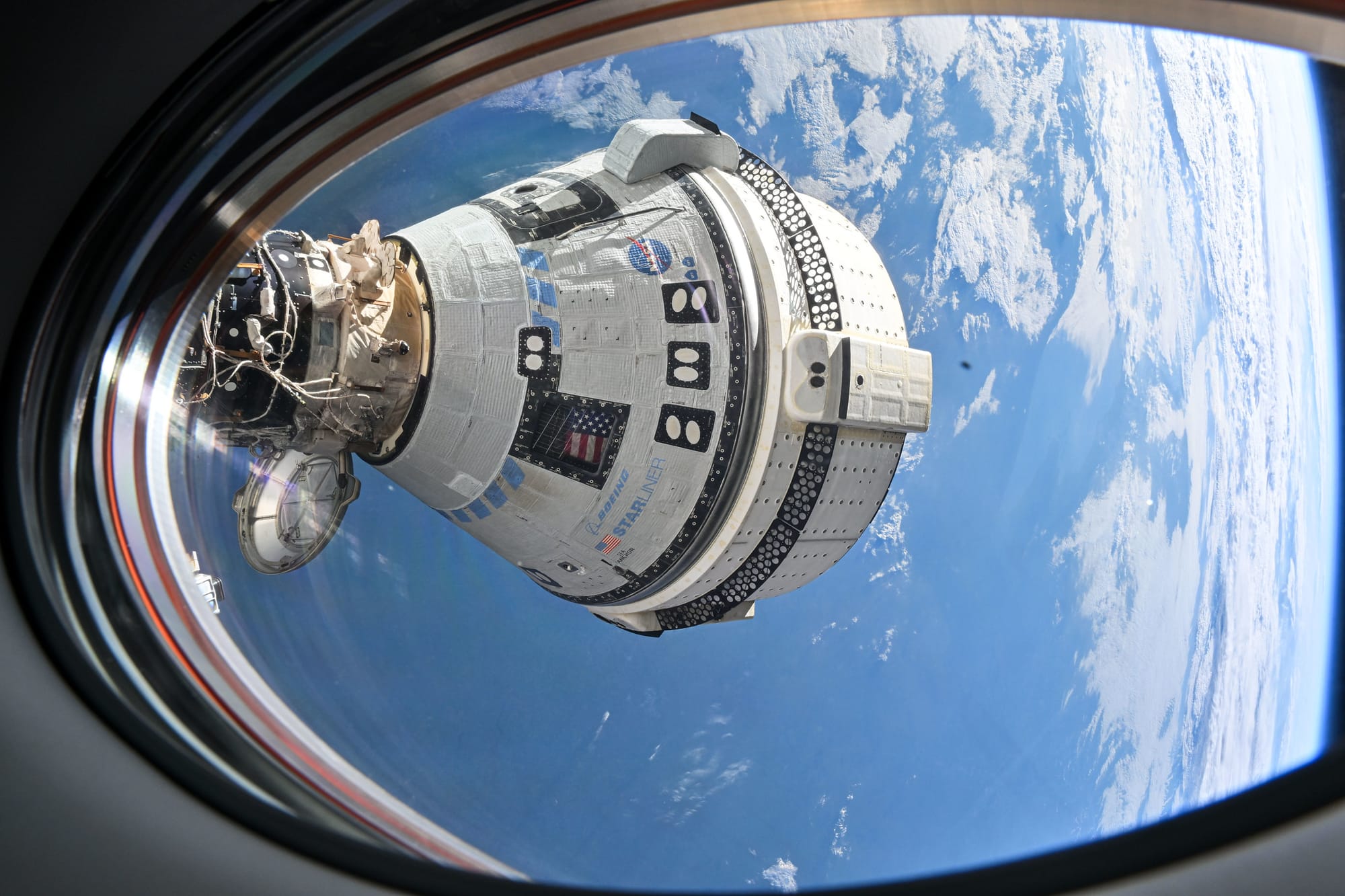 Boeing's Starliner spacecraft docked to the International Space Station seen from SpaceX's Crew-8 Dragon spacecraft. ©NASA/Boeing