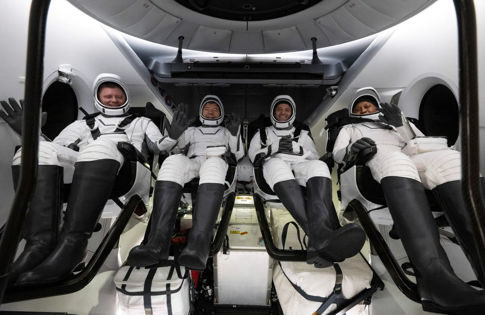 NASA's Crew 8 crew inside Crew Dragon after returning to Earth, Alexander Grebenkin (left), Michael Barratt (center left), Matthew Dominick (center right), and Jeanette Epps (right) ©Joel Kowsky/NASA