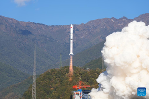 Long March 2D lifting off from Xichang Satellite Launch Center via Xinhua News.