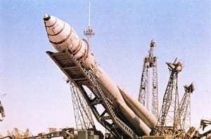 Vostok-1 atop of its R-7 rocket during rollout to the launchpad.
